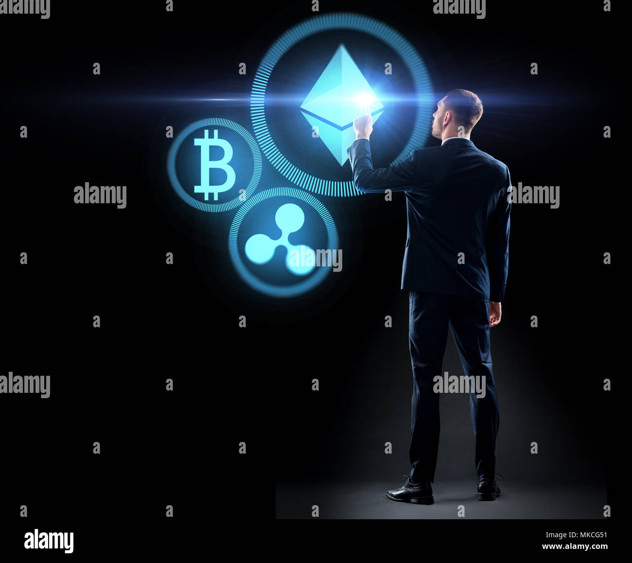 buisnessman with cryptocurrency holograms Stock Photo