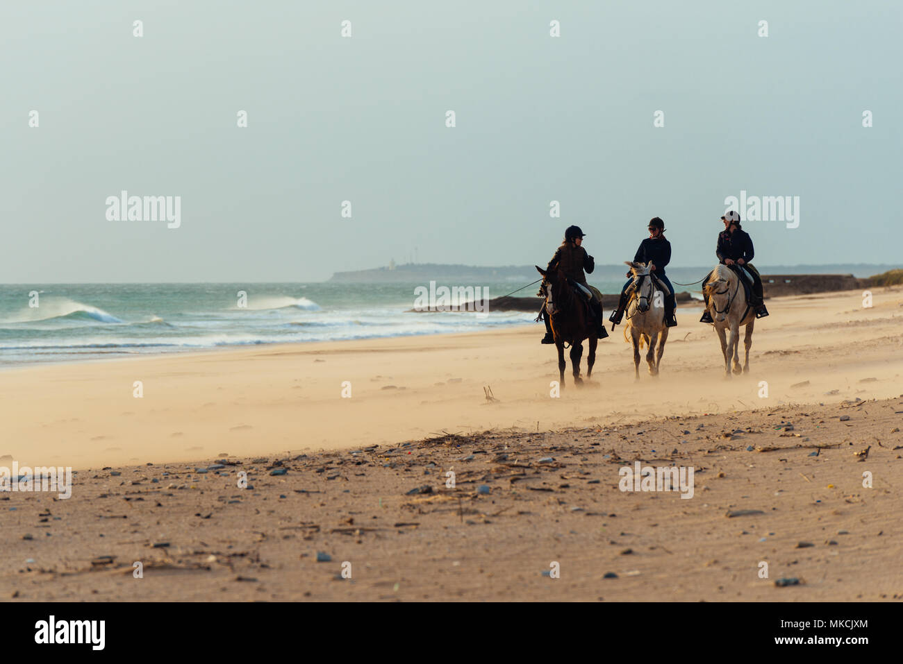 Horse riding on the beach in the south of Spain Stock Photo