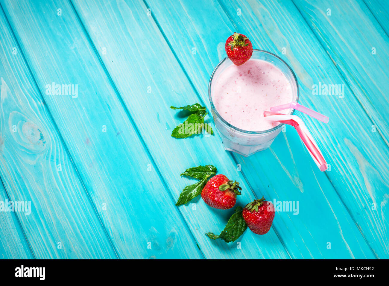 Strawberries milk shake and fresh fruit strawberry. Cocktail with milk