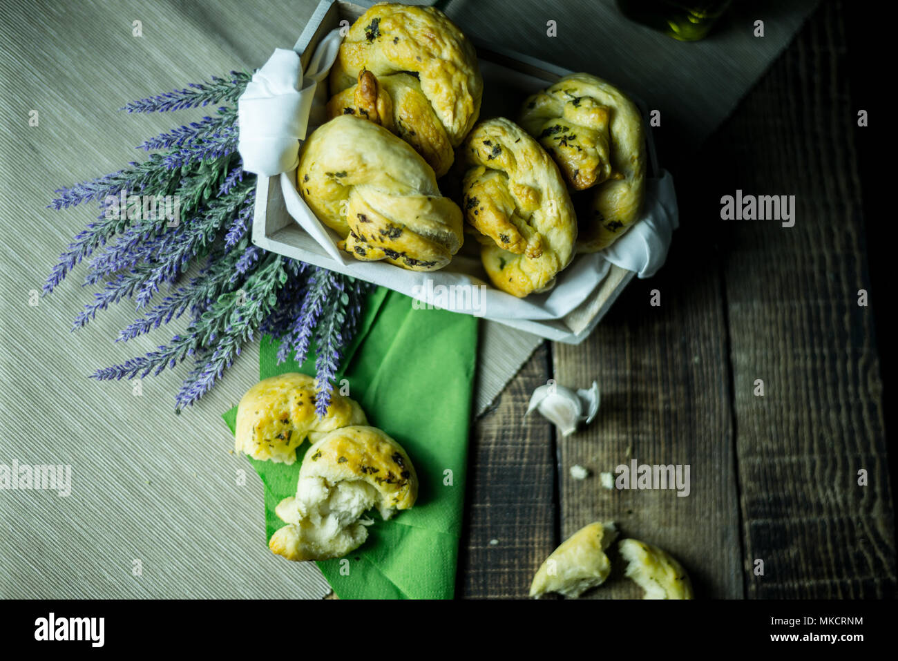 greaves with oil and spices, on a traditional wooden countertop with candle and black background, Stock Photo