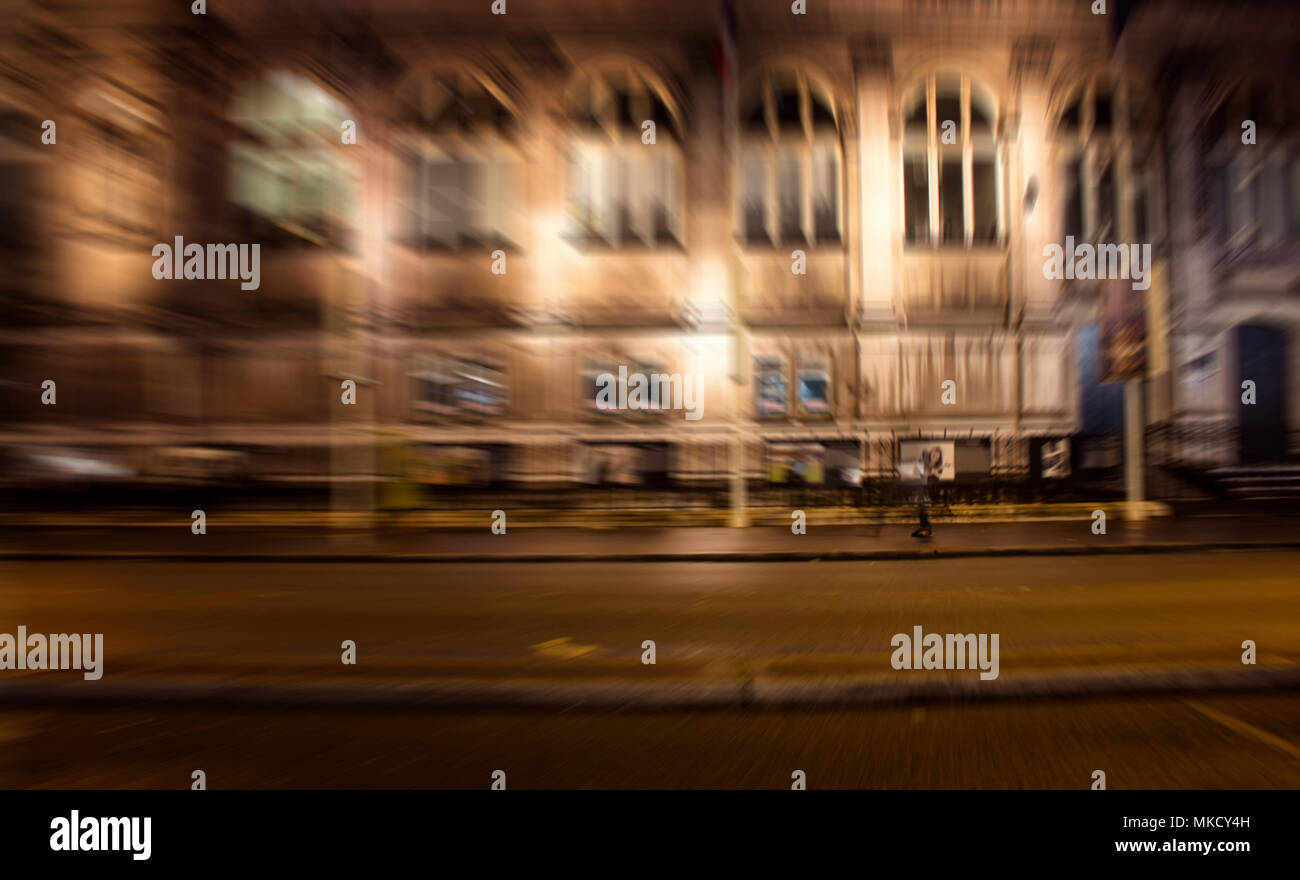 Blurry motion image of people walking on street at night in Paris Stock ...