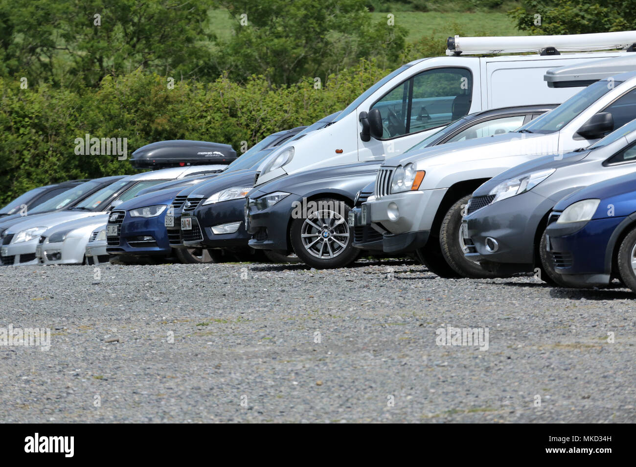 June 2014 - Line of parked cars and vans Stock Photo