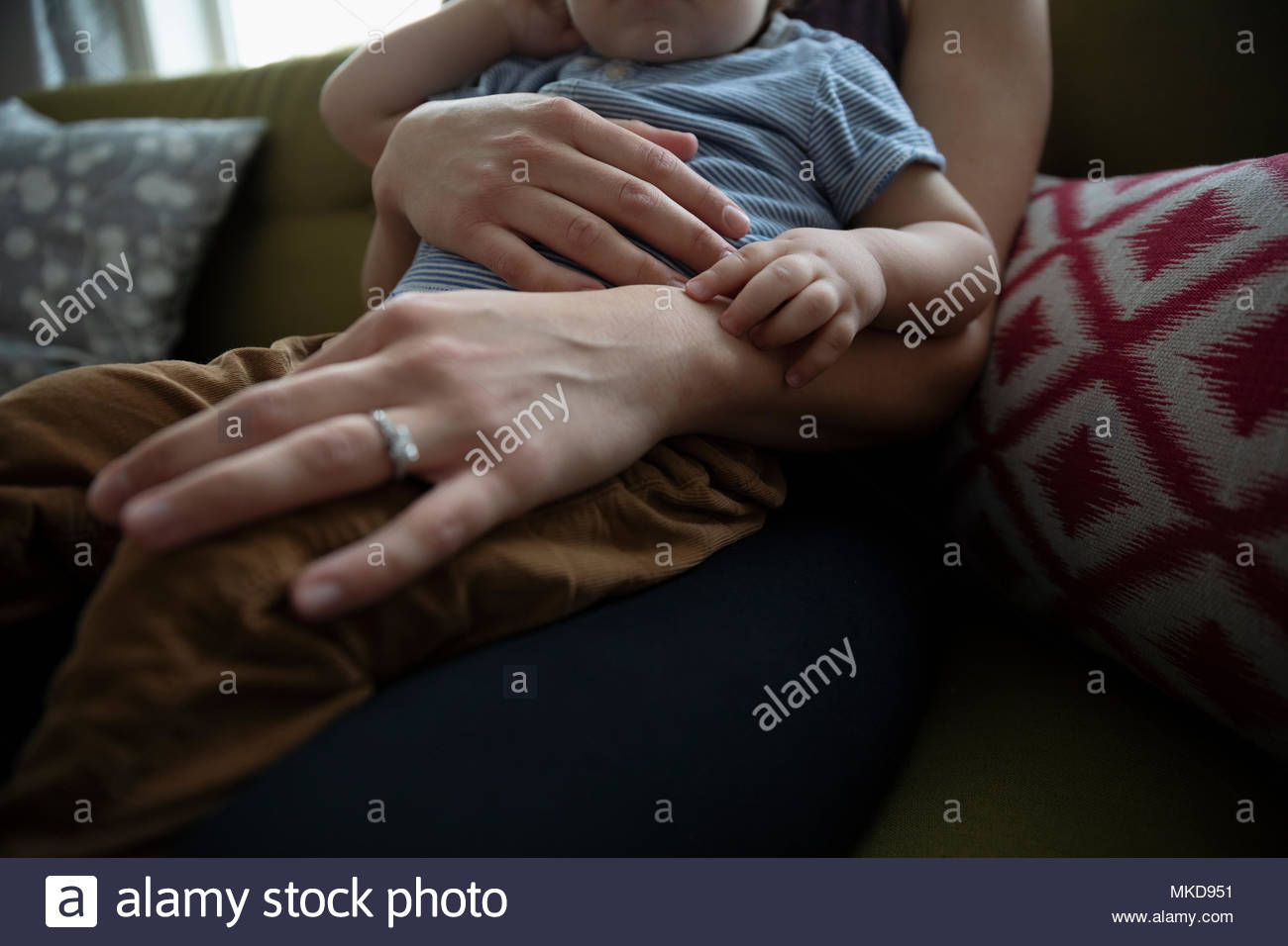 Close up affectionate mother holding baby son Stock Photo