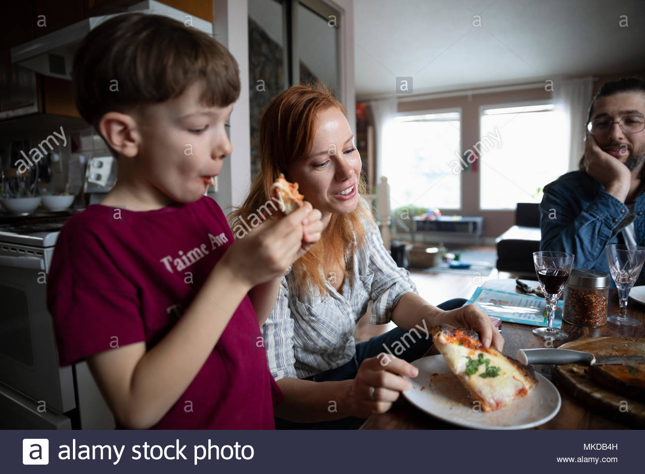Boy sitting table eating plate hi-res stock photography and images - Alamy