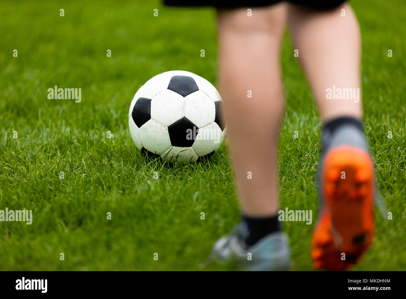 Football Or Soccer Ball At The Kickoff Of A Game Soccer Free Kick At A Grass Pitch Young Soccer Player With Traditional Football Ball Stock Photo Alamy
