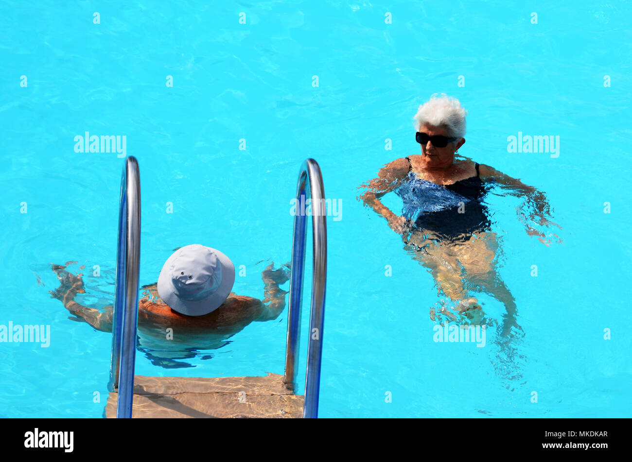 Elderly woman swim in pool hi-res stock photography and images - Alamy