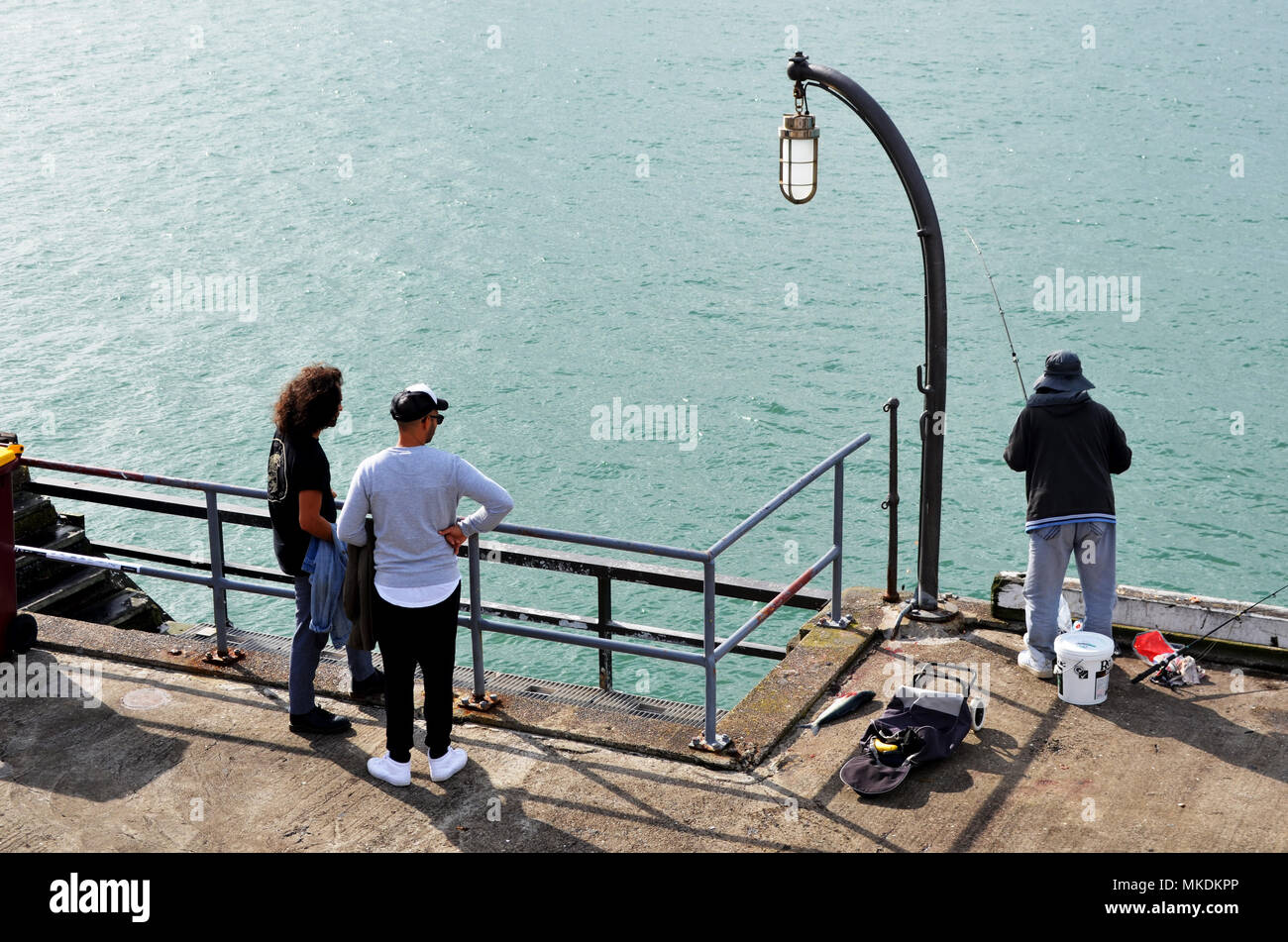 Men fishing on wharf at Auckland New Zealand Stock Photo Alamy