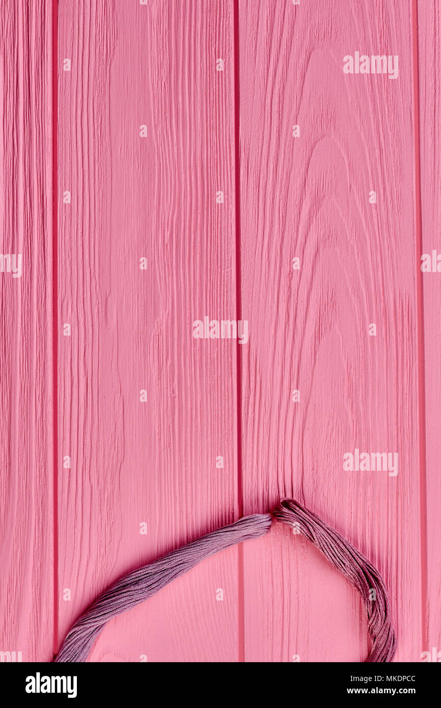Bundles of colorful threads, cropped image. Pink threads for embroidery ...