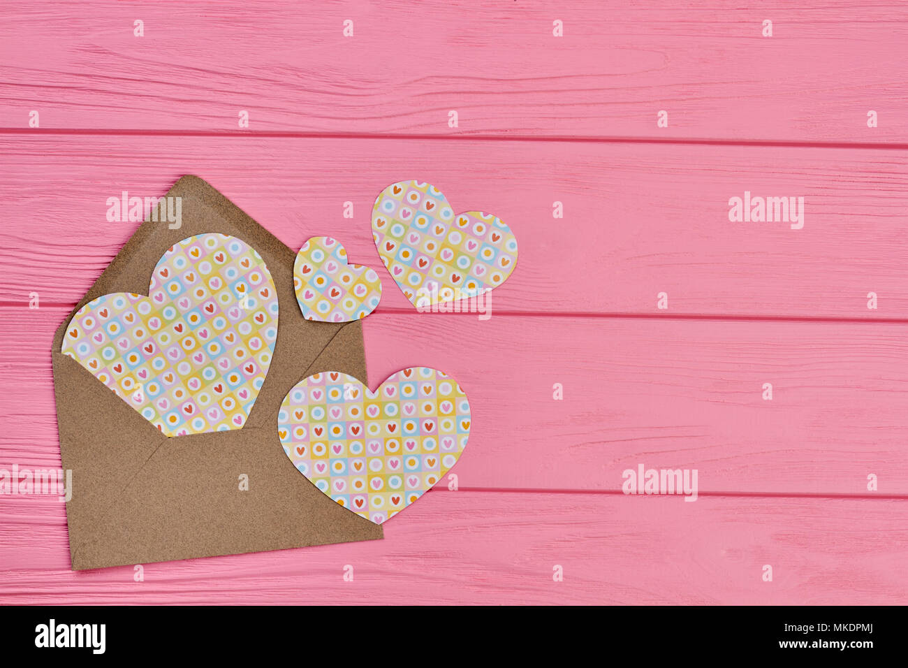 Envelope with paper hearts, copy space. Valentines Day background with ...