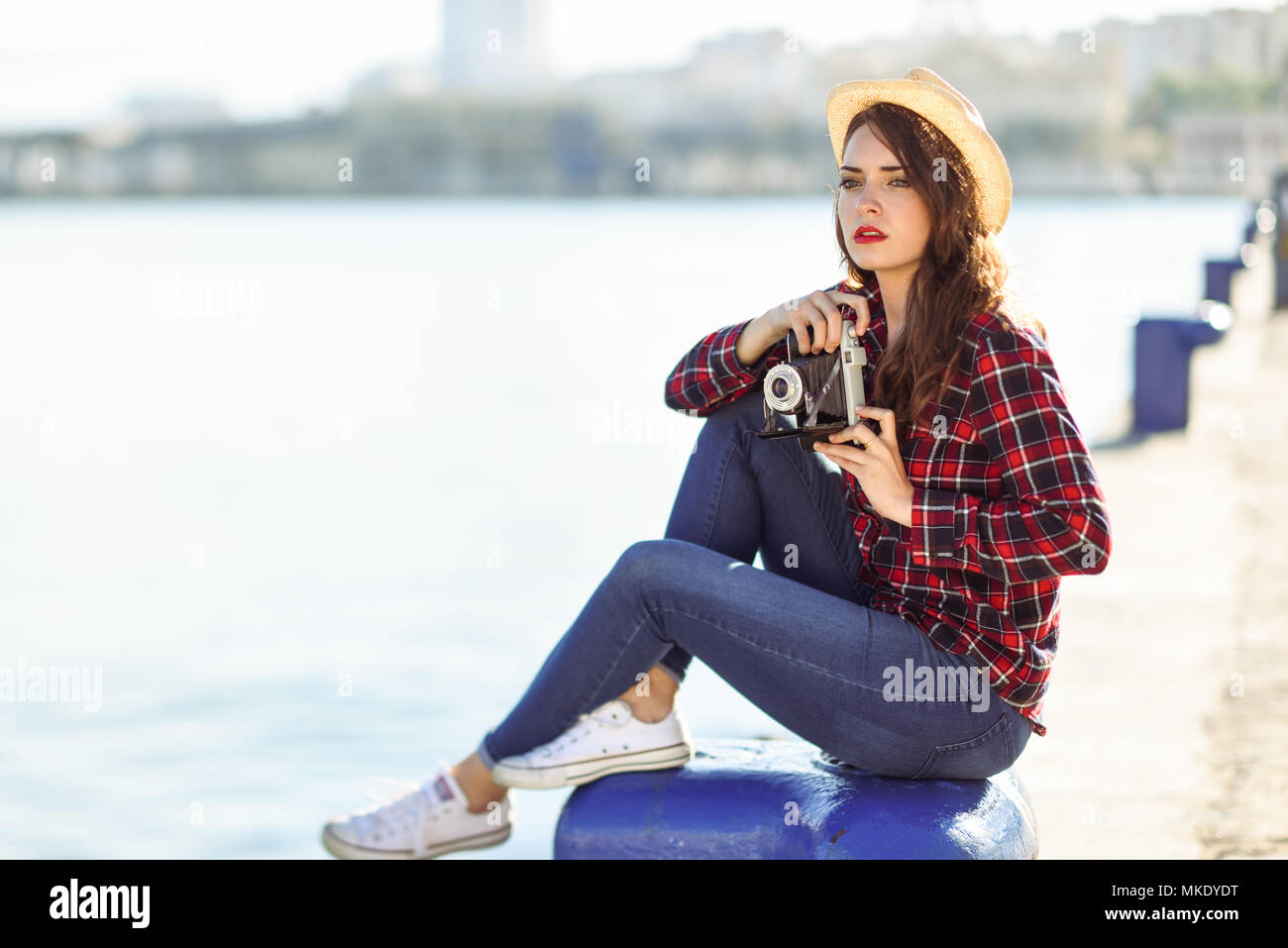 harbour. Girl wearing plaid shirt 