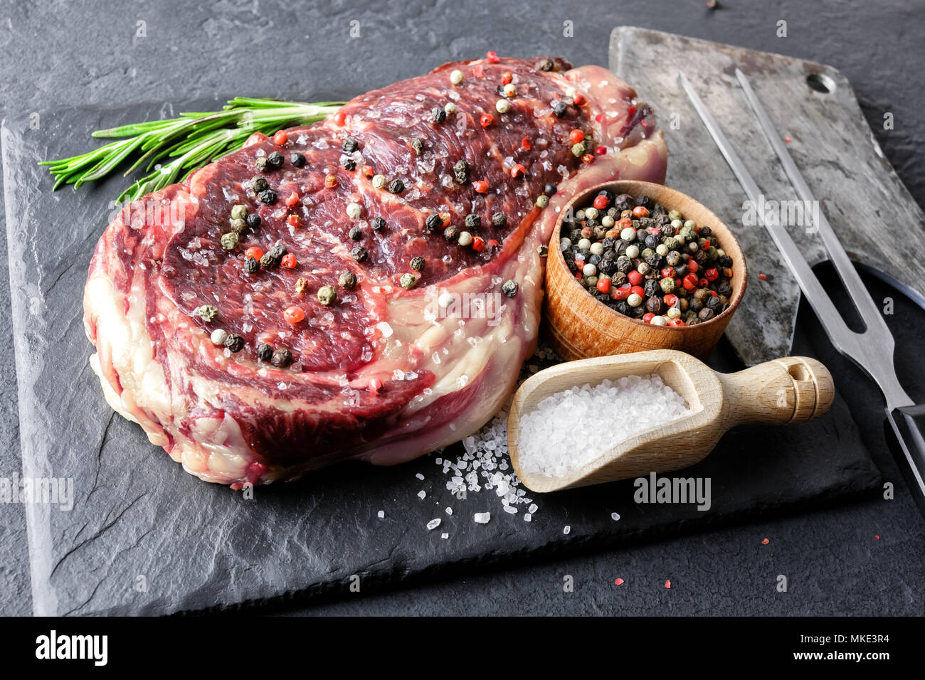 Marbling ribeye steak on black plate Stock Photo