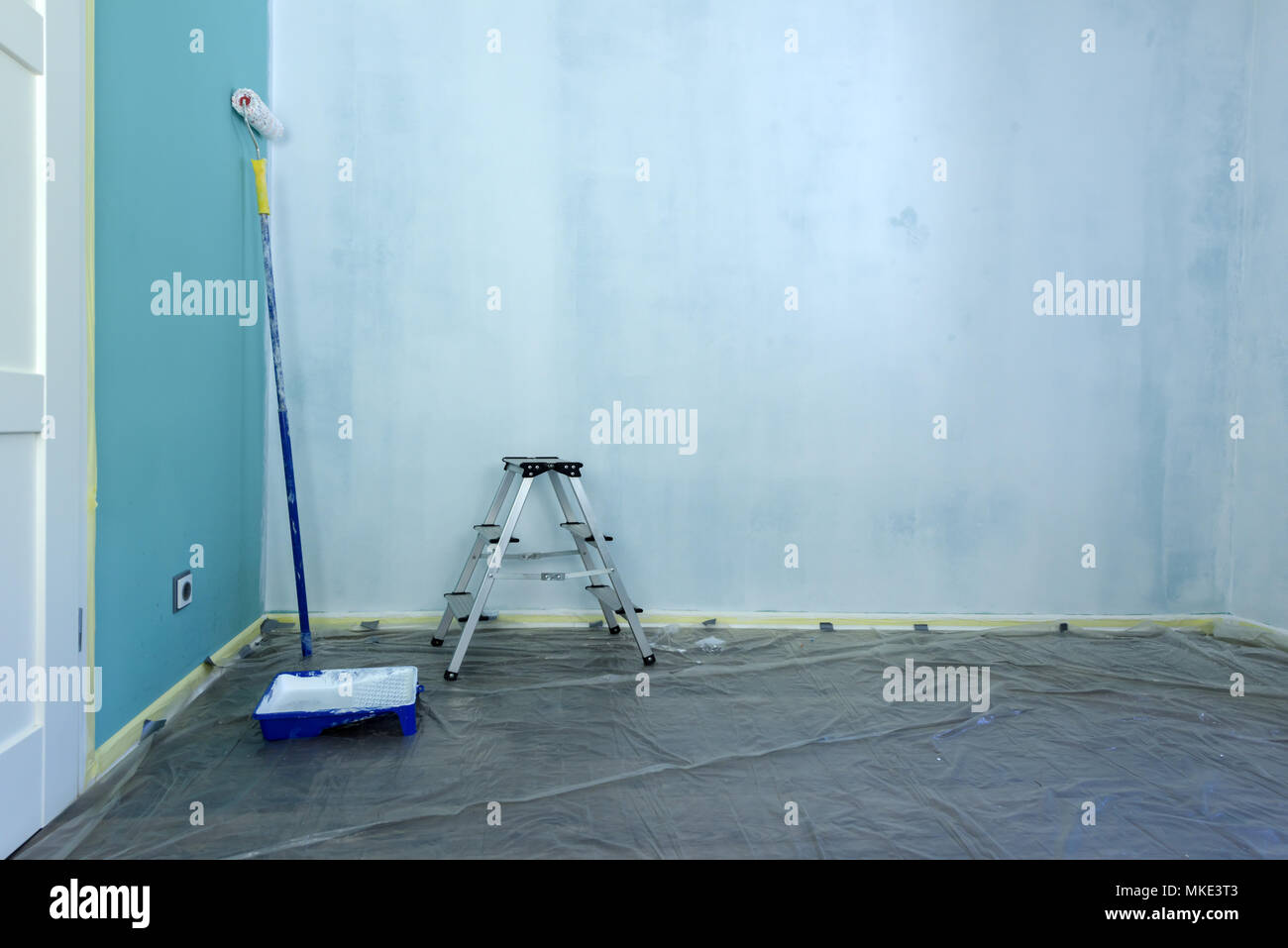 Painting tools on wall background Stock Photo Alamy