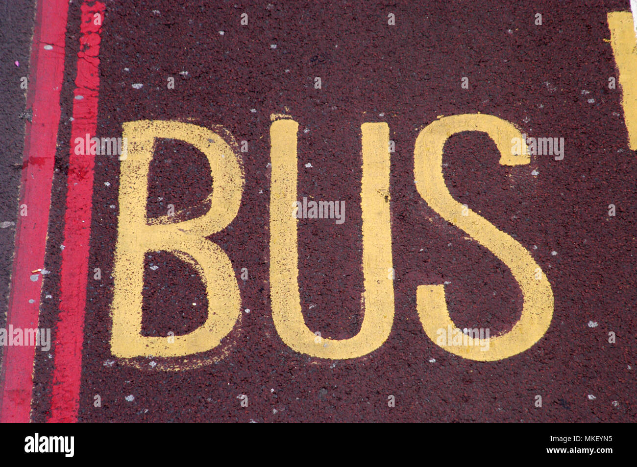 city centre traffic control zones bus lane only with red lines on red tarmac Stock Photo