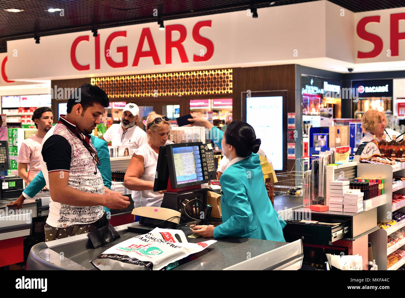 Dubai, UAE - April 10. 2018. The buyer at checkout in duty free shop at the airport Stock Photo