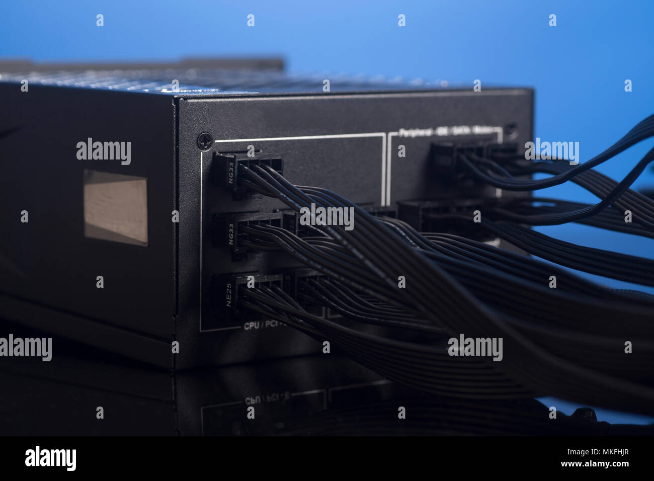 Computer Power Supply Unit with cable on blue background Stock Photo ...