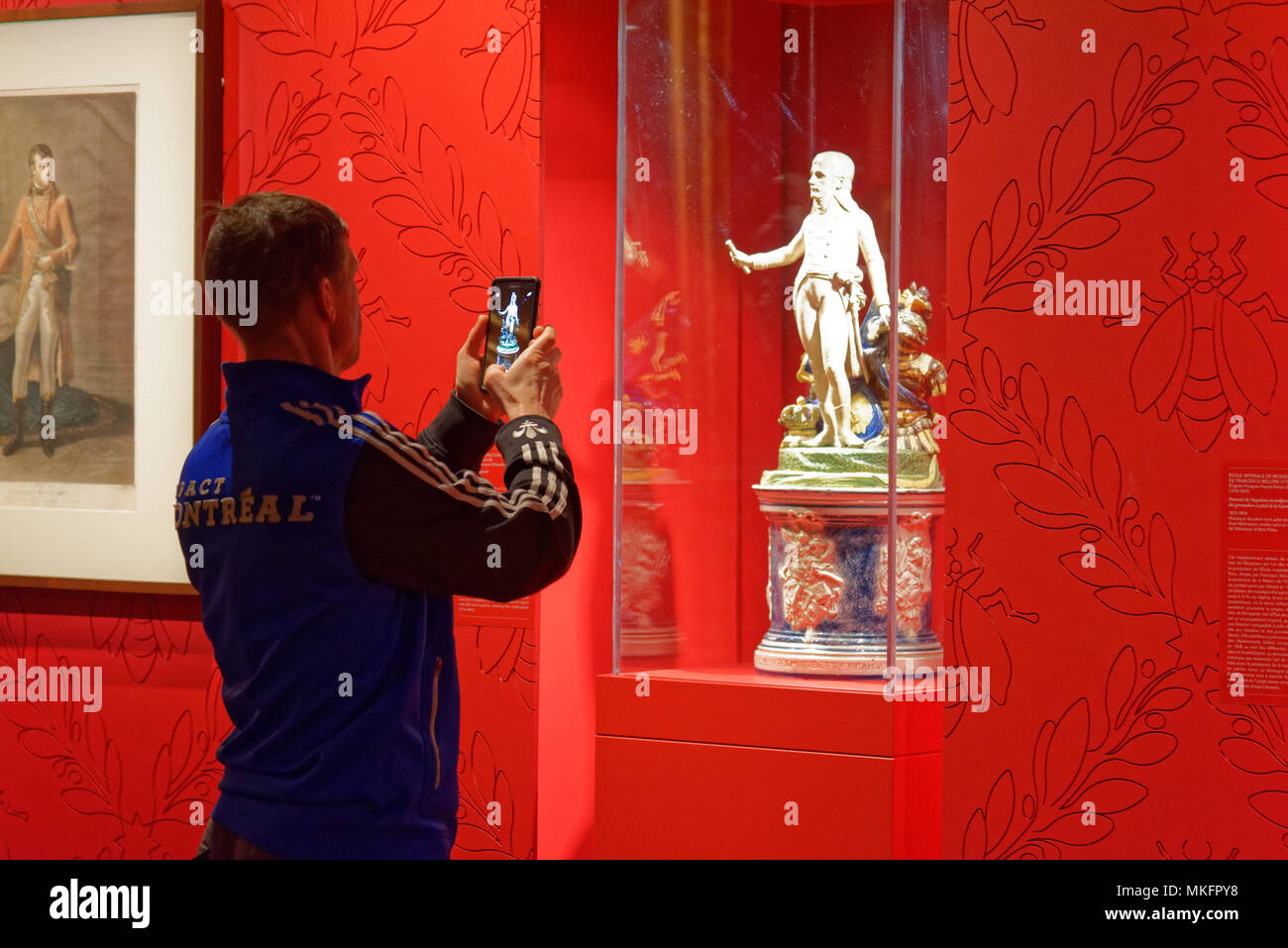 A man taking  a picture of a sculpture of Napoleon in the Montreal Fine Arts Museum Stock Photo