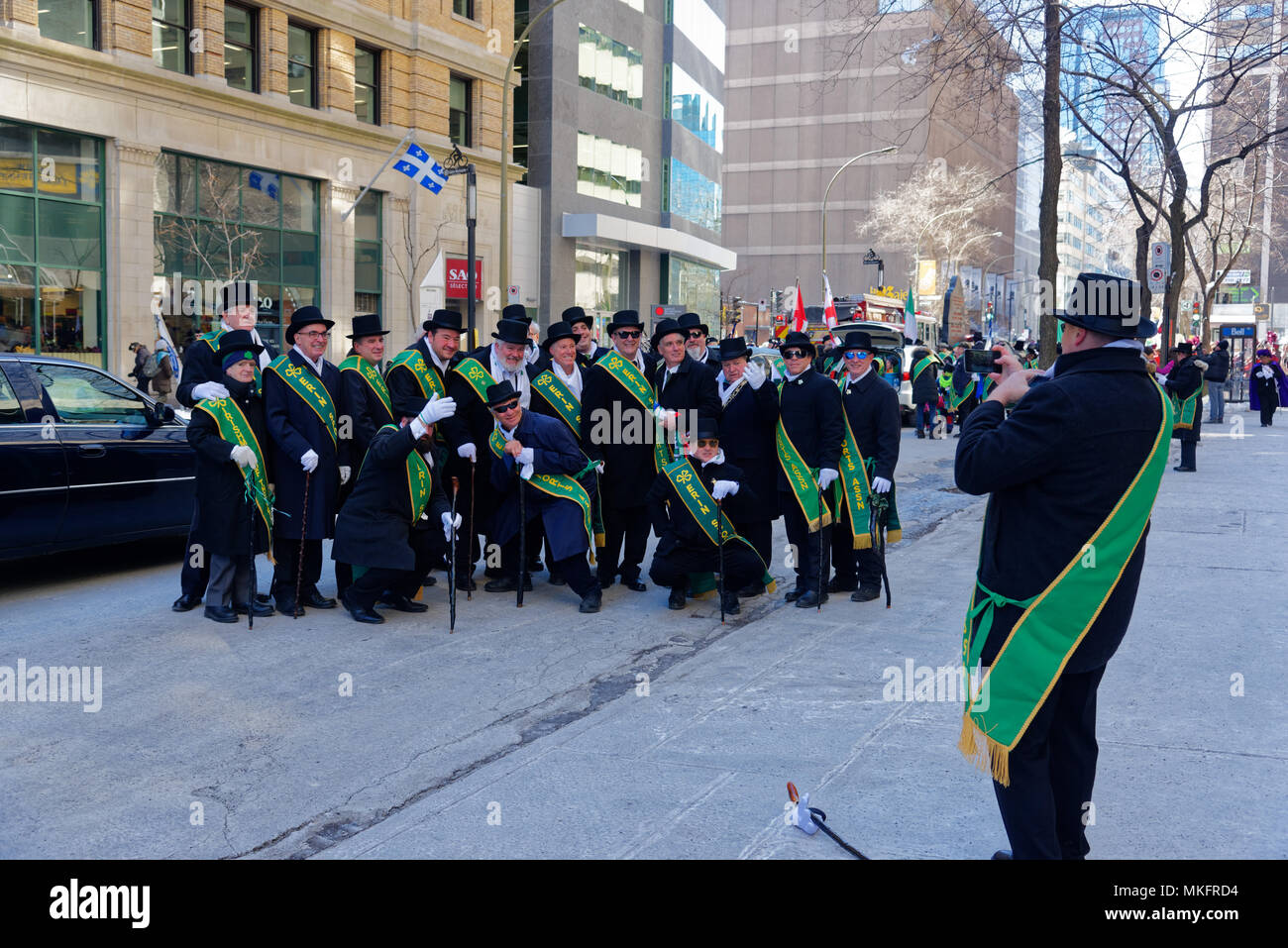 members of Erin Sports Association pose for their photo in the Montreal St Patricks Day Parade Stock Photo