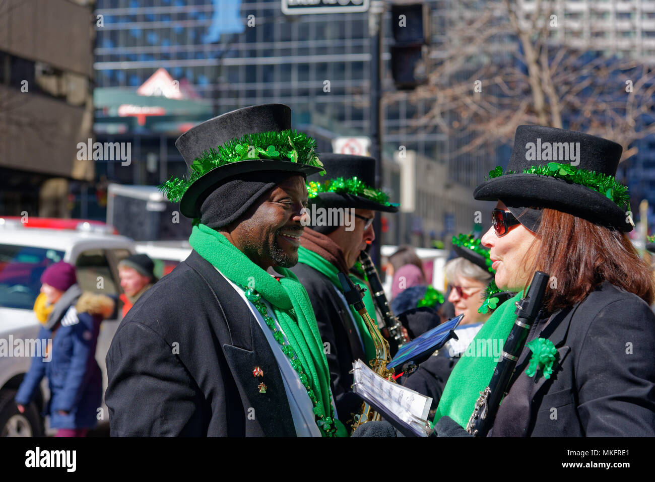 A black man wearing green in Montreal Saint Patrick's Day Parade Stock Photo