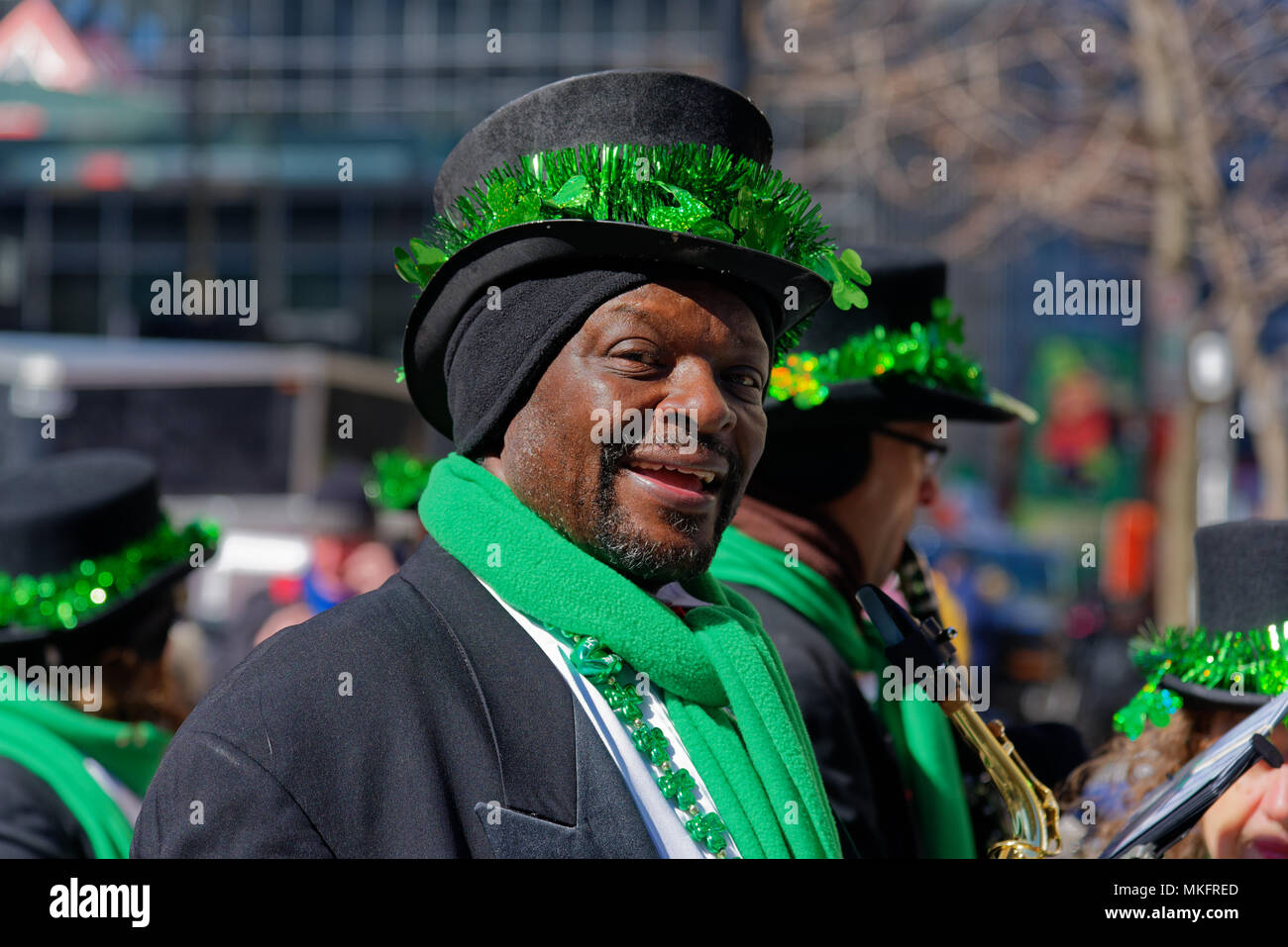 A black man wearing green in Montreal Saint Patrick's Day Parade Stock Photo