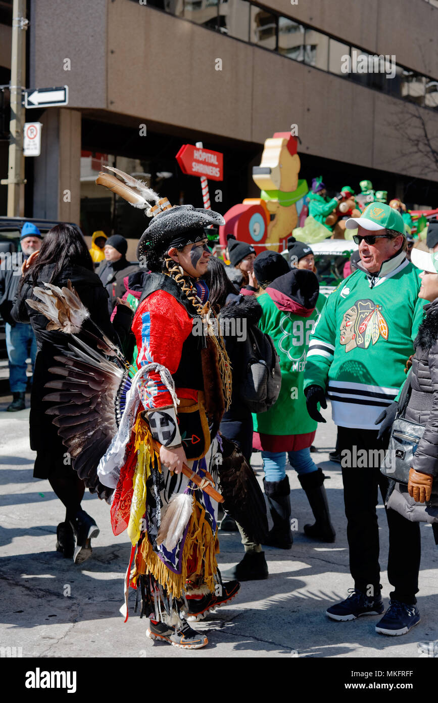 An Amerindian in full Mohawk costume at Montreal St Patrick's Day Parade Stock Photo