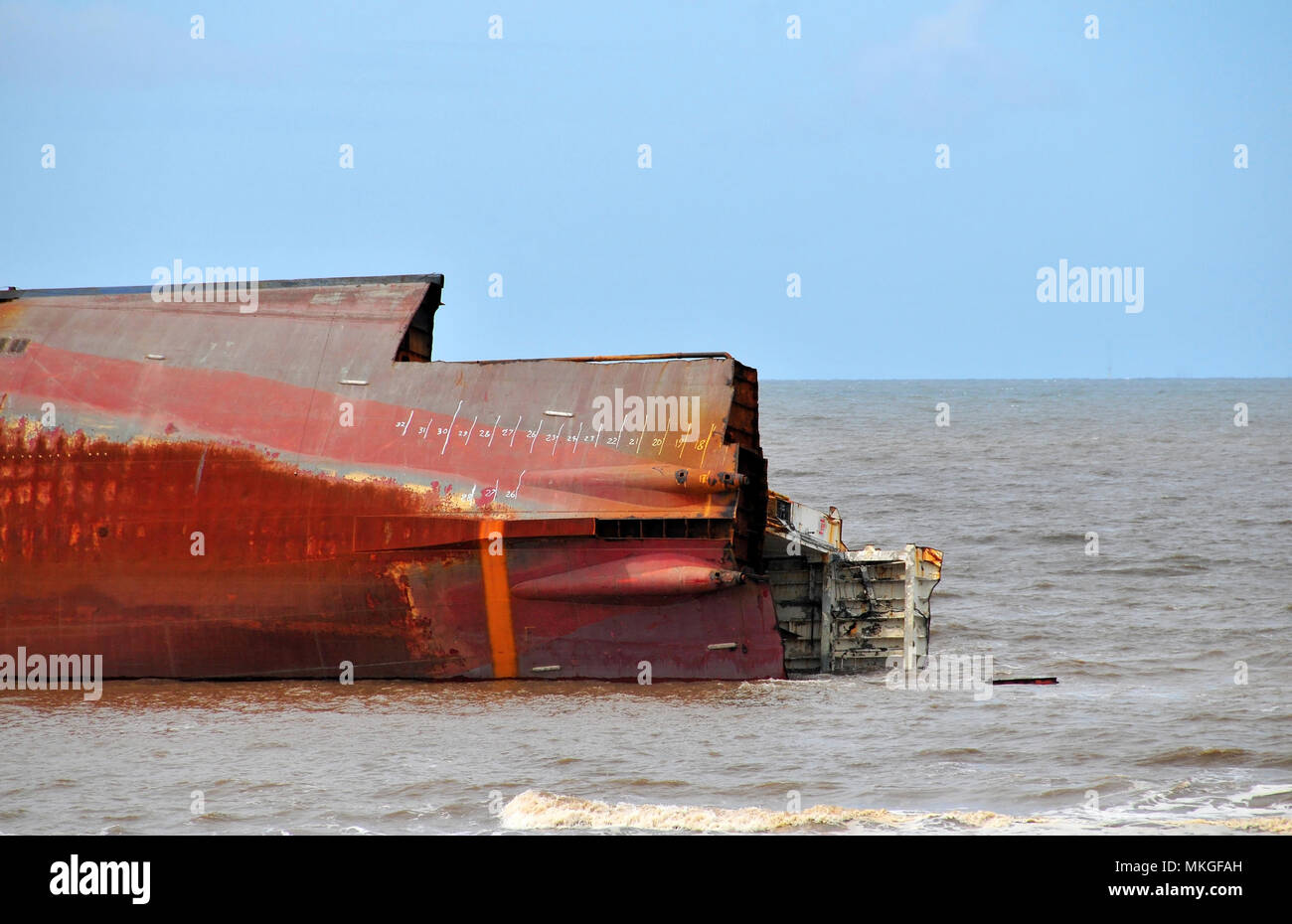 Blue sky high tide view Riverdance Ferry Wreck . lying on its side, stern plates propellors removed, Anchorsholme, Cleveleys, Blackpool Lancashire, UK Stock Photo