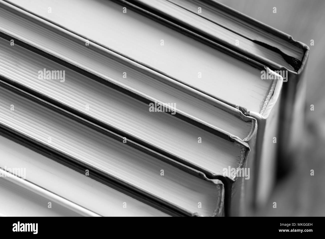 Closeup of a stack of books. Black and white photography Stock Photo
