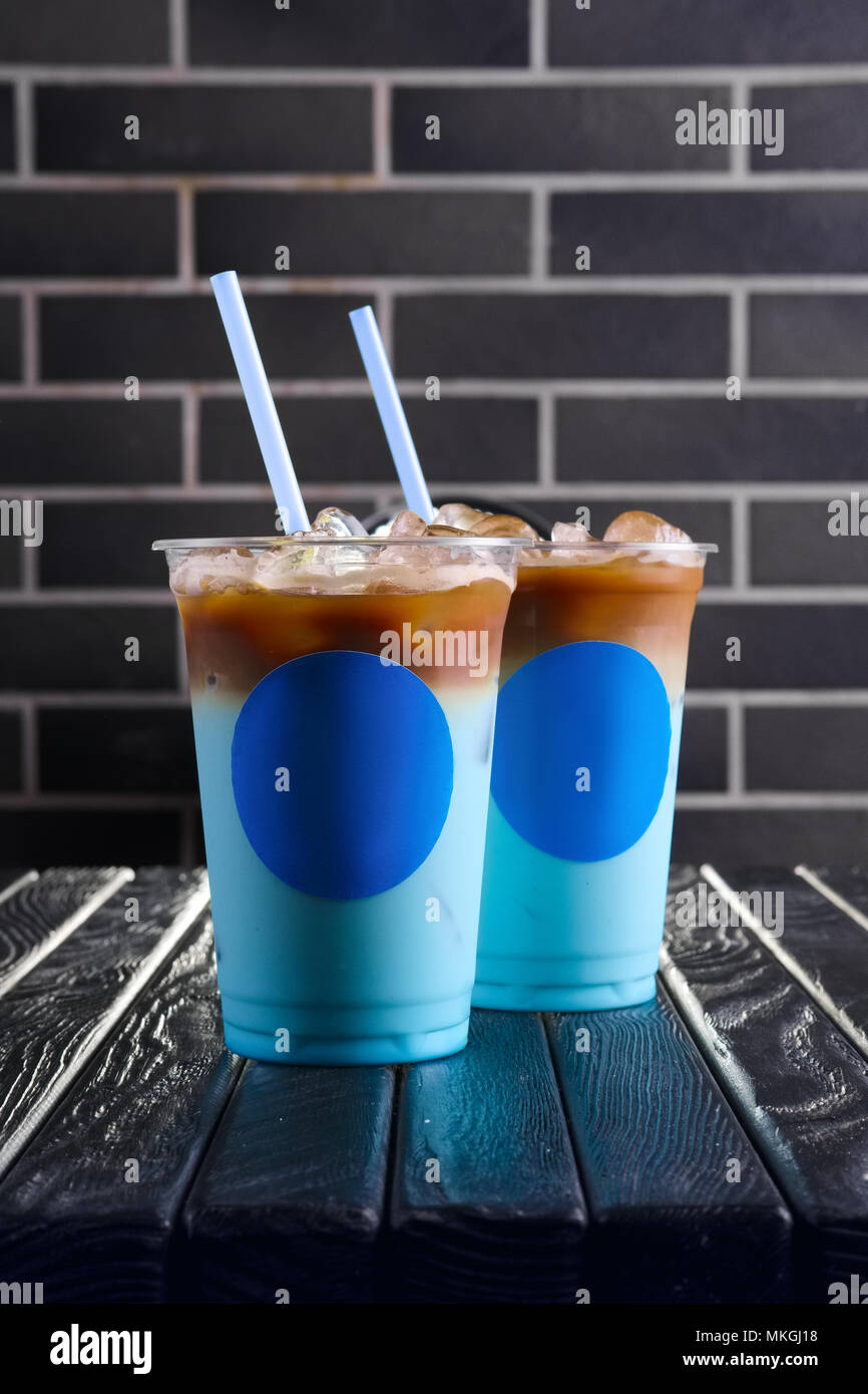 https://c8.alamy.com/comp/MKGJ18/concept-of-blue-coffee-cocktail-plastic-take-away-cup-of-blue-ice-drink-MKGJ18.jpg
