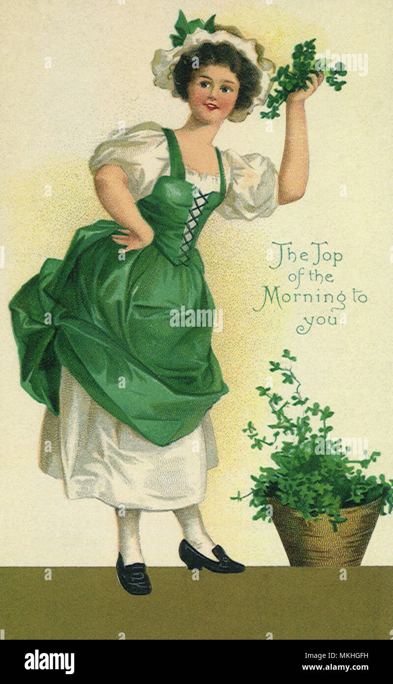 Woman Holding Clover Stock Photo