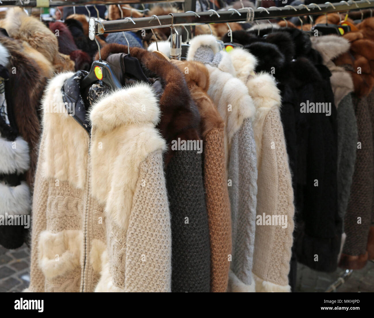 many fur coat for sale at stall of market in the street Stock Photo Alamy