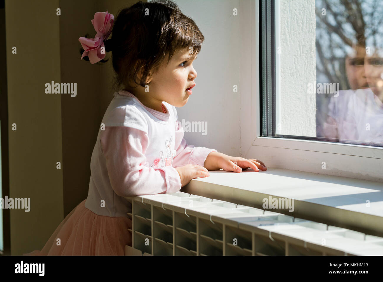Girl Waiting at window Stock Photo