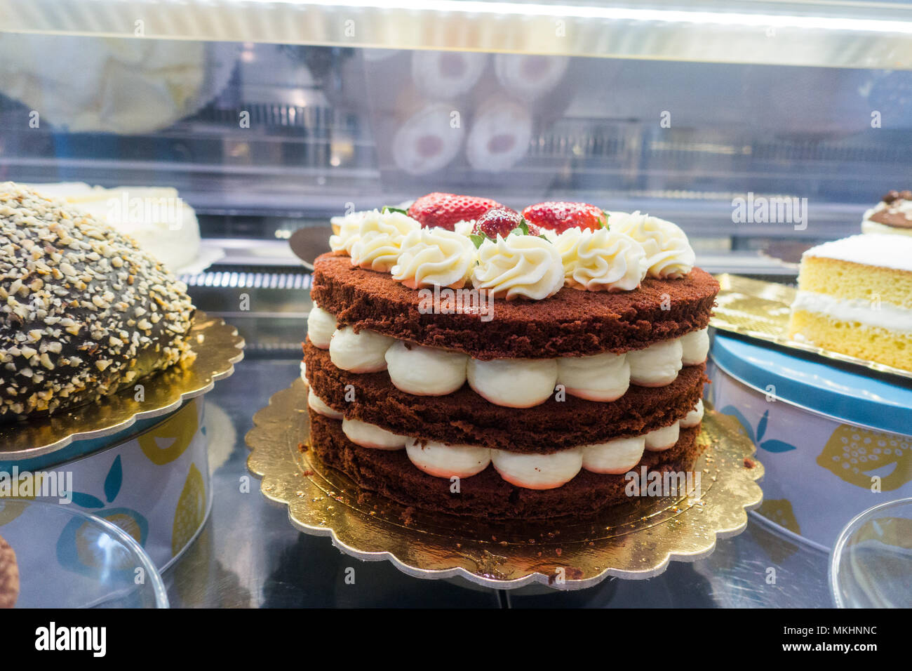 Cakes on display at cafe in italay Stock Photo