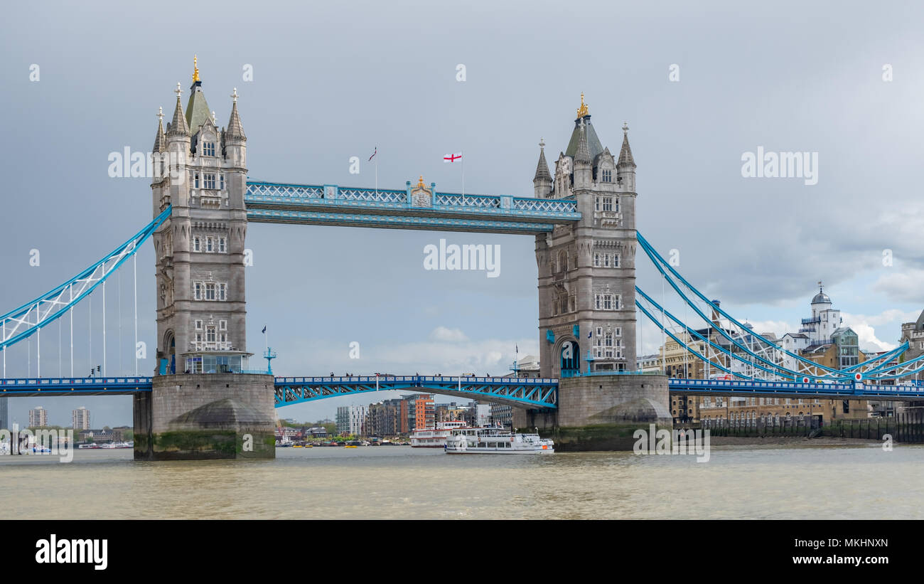 Tower Bridge spans the Thames River near the Tower of London.  A combination suspension and bascule bridge, it was built between 1886 and 1894. Stock Photo