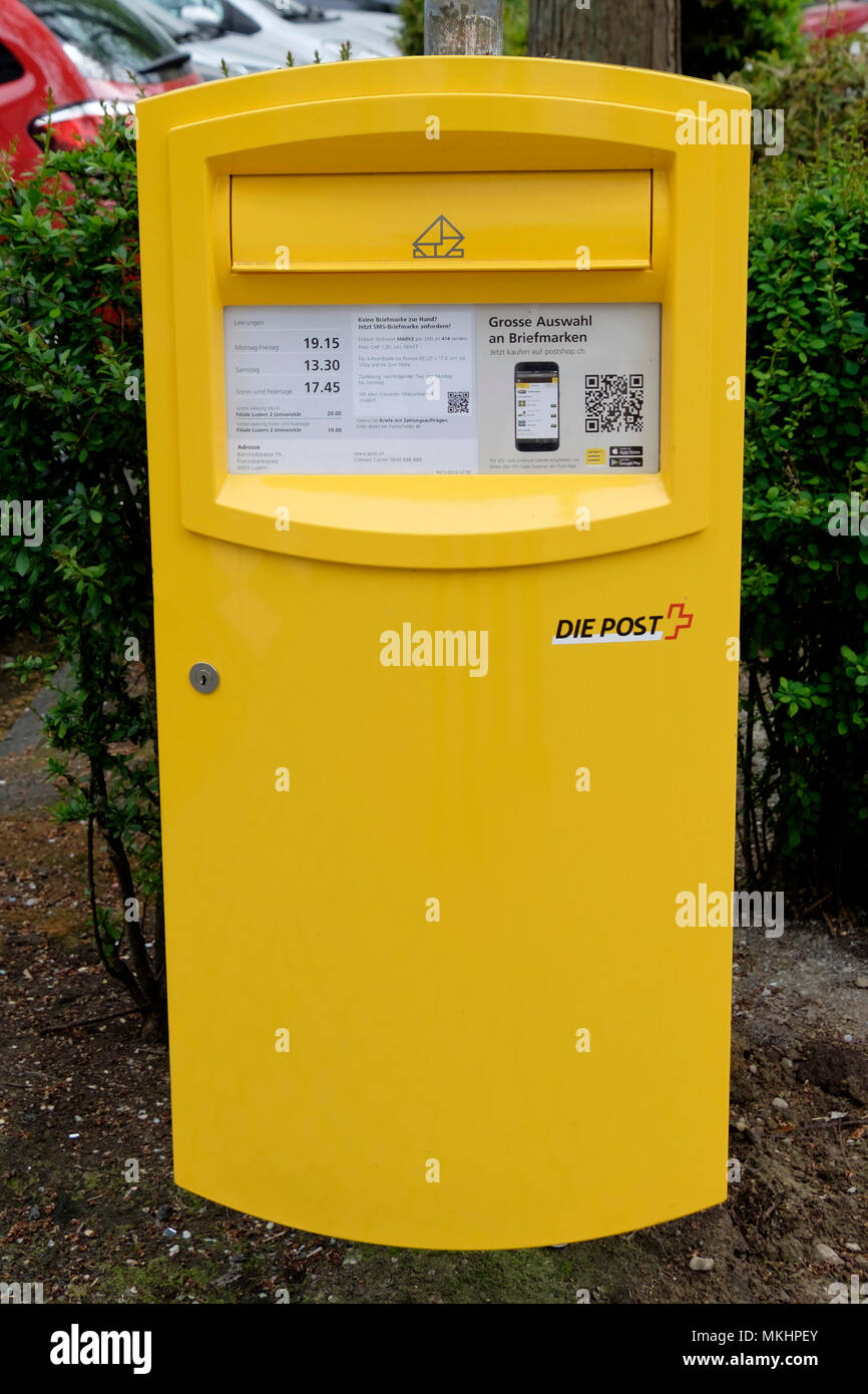 Yellow Die Post letter box in Lucerne, Switzerland, Europe Stock Photo