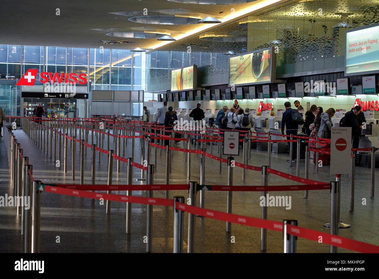 Retractable belt rope barriers for queuing to access the check-in desks at Zurich aiport in Zurich, Switzerland, Europe Stock Photo