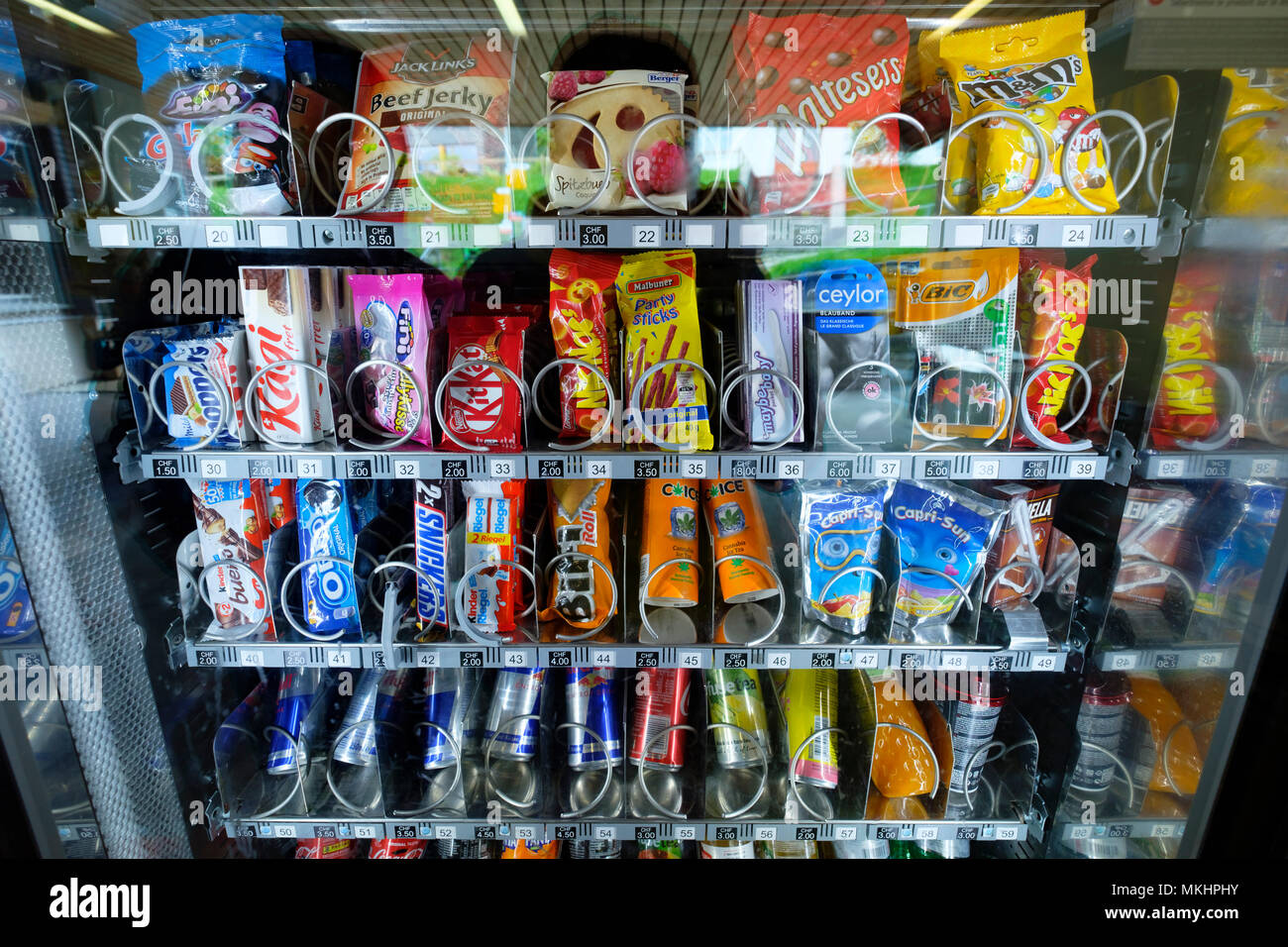 Vending machine selling unhealthy food snacks and sodas Stock Photo