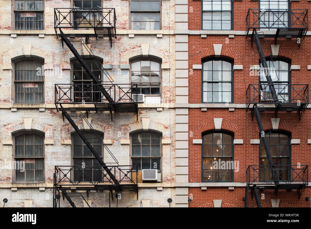 Close-up view of New York City style apartment buildings with emergency stairs along Mott Street in the Chinatown neighborhood of Manhattan NYC. Stock Photo