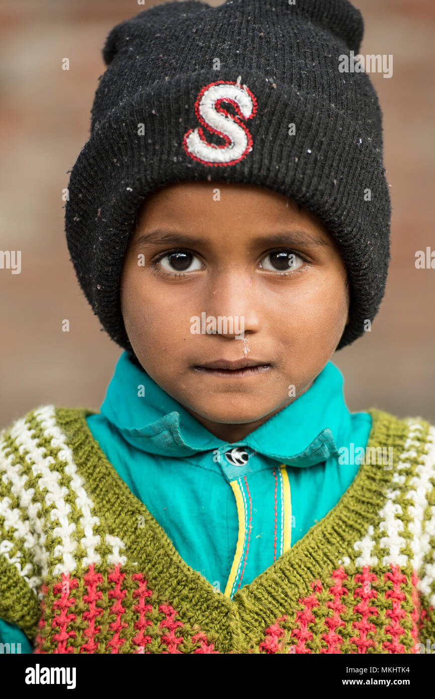 RAJASTHAN - INDIA - 05 JANUARY 2018. Portrait of a young boy with his black hat. Picture taken from a rural village in Rajasthan. India. Stock Photo