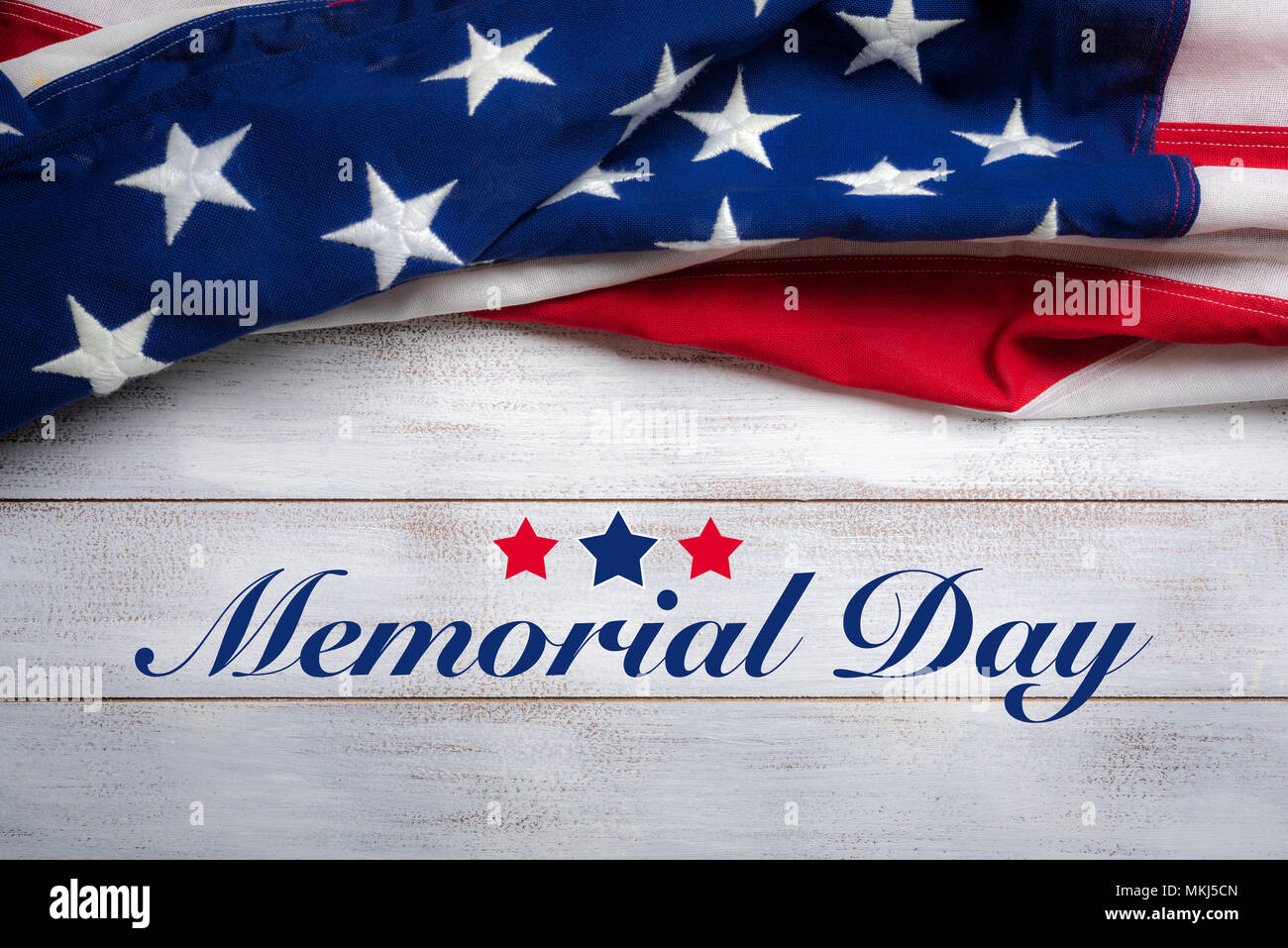 American flag on a white worn wooden background with memorial day ...