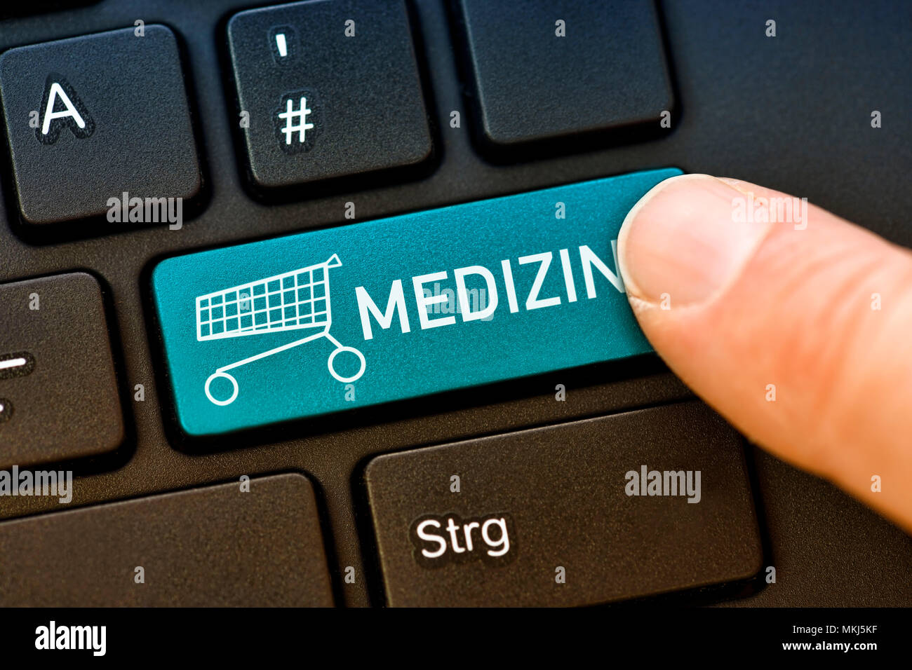 Computer button labeled medicine, online shopping of drugs, Computertaste mit der Aufschrift Medizin, Onlineshopping von Medikamenten Stock Photo