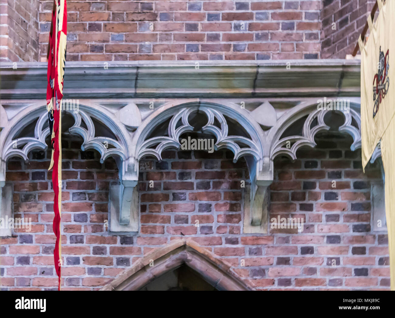 Detail of a brick cathedral in the Gothic style. Carved limestone decor on the side facade.  St.Mary Magdalene Church. Wroclaw,Poland. Stock Photo