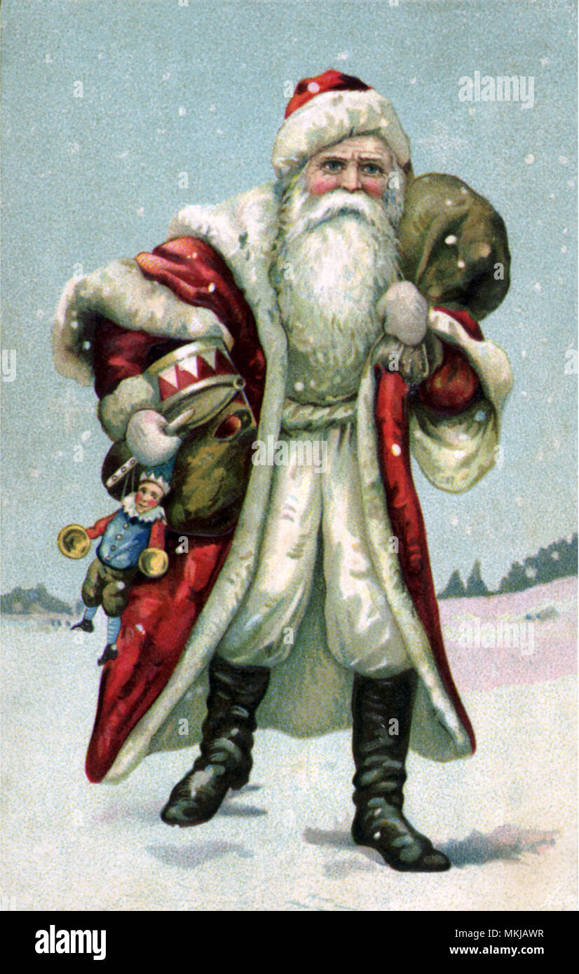 Santa Carrying Toys Stock Photo - Alamy