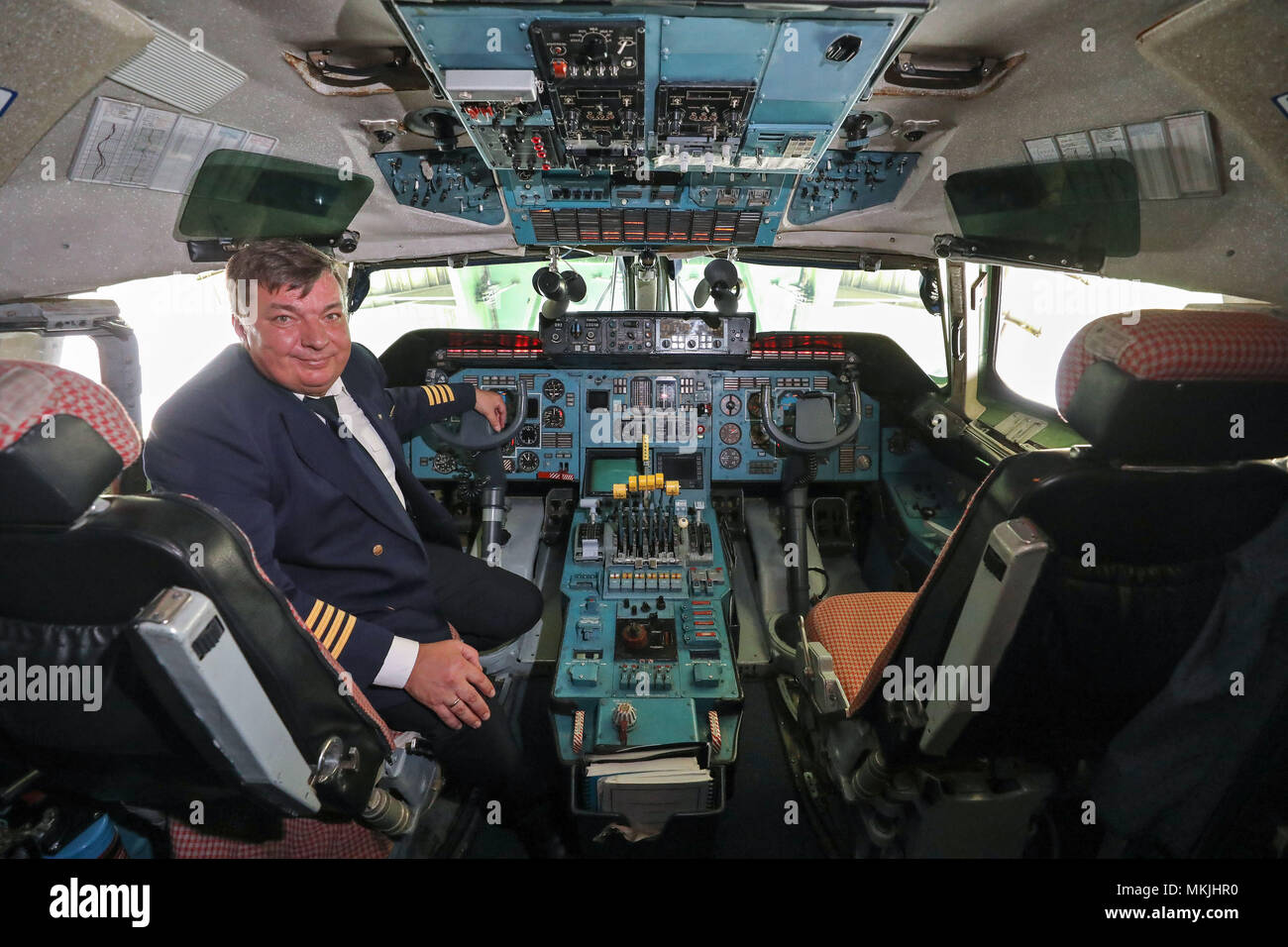 07 May 2018, Germany, Schkeuditz, Leipzig-Halle airport: The pilot Dmitri Antonov sitting in the cockpit of the Antonov 225. The cargo aircraft measuring 84 metres in length, 89 metres in width, and 18 metres in height is one of a kind. The airplane was originally built for the Soviet space shuttle Buran, and can transport cargo weighing up to 250 tons. The freight space equates the entire trunk of a Boeing 737. Photo: Jan Woitas/dpa-Zentralbild/dpa Credit: dpa picture alliance/Alamy Live News Stock Photo