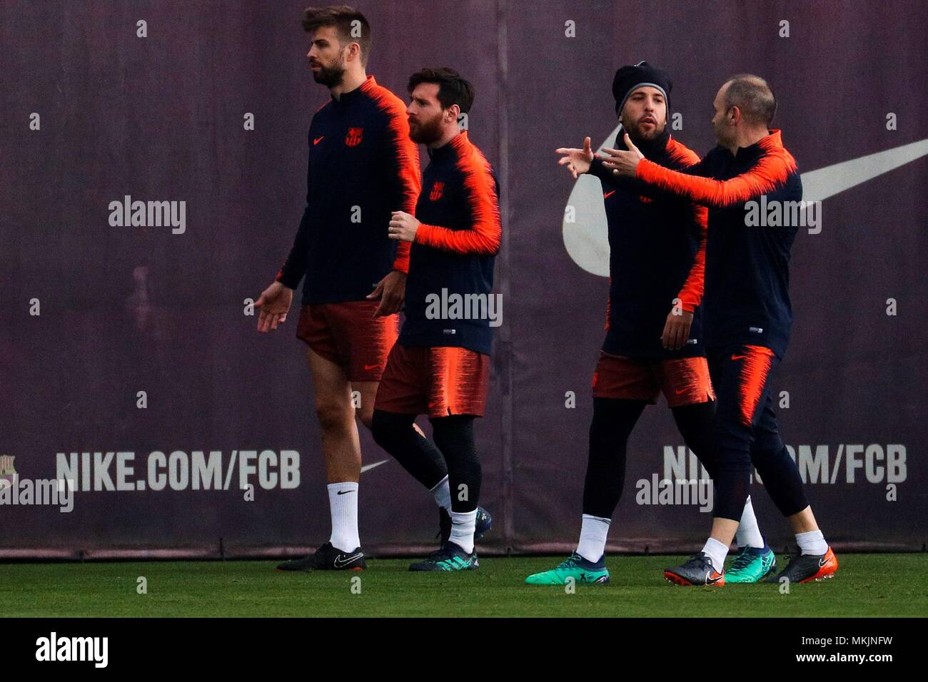 FC Barcelona's players Gerard Pique (L), Leo Messi (2L), Jordi Alba (2R)  and Andres Iniesta (R) participate in a training session of the team at the  Camp Nou stadium in Sant Joan