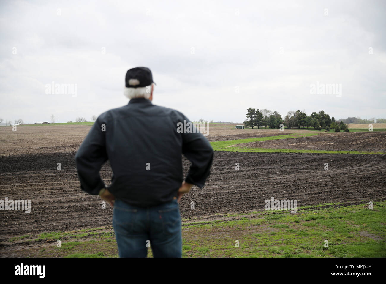 (180509) -- IOWA, May 9, 2018 (Xinhua) -- Rick Kimberley looks at the field at his farm near Des Moines, capital of Iowa State, May 3, 2018. Rick and his son, Grant, grow more than 4,000 acres of corn and soybeans with a couple of hired hands and massive combines whose computers precisely track yield, moisture and other key statistics for each row and acre. He has been to China 15 times in recent years to talk about precision farming and other tricks of his trade, becoming an ambassador for modern farming methods in China. As for the current trade tensions between the United States and China, Stock Photo