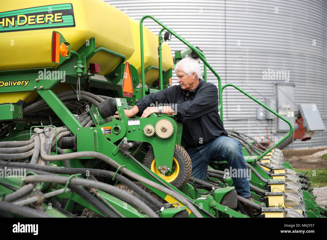(180509) -- IOWA, May 9, 2018 (Xinhua) -- Rick Kimberley checks a farming combine machine at his farm near Des Moines, capital of Iowa State, May 3, 2018. Rick and his son, Grant, grow more than 4,000 acres of corn and soybeans with a couple of hired hands and massive combines whose computers precisely track yield, moisture and other key statistics for each row and acre. He has been to China 15 times in recent years to talk about precision farming and other tricks of his trade, becoming an ambassador for modern farming methods in China. As for the current trade tensions between the United Stat Stock Photo