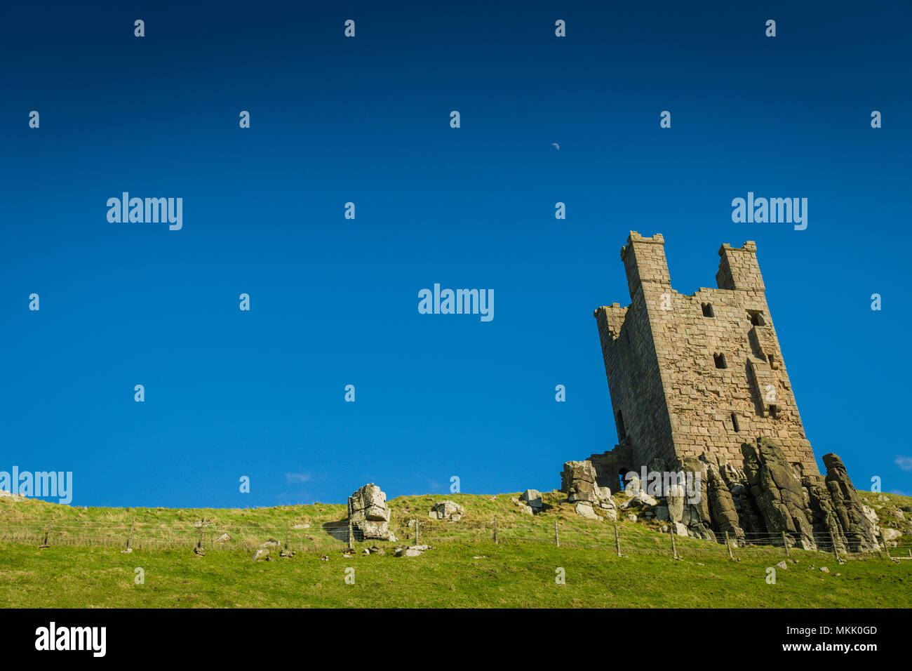 Lilburn Tower, Dunstanburgh Castle, Northumberland, UK. Stock Photo