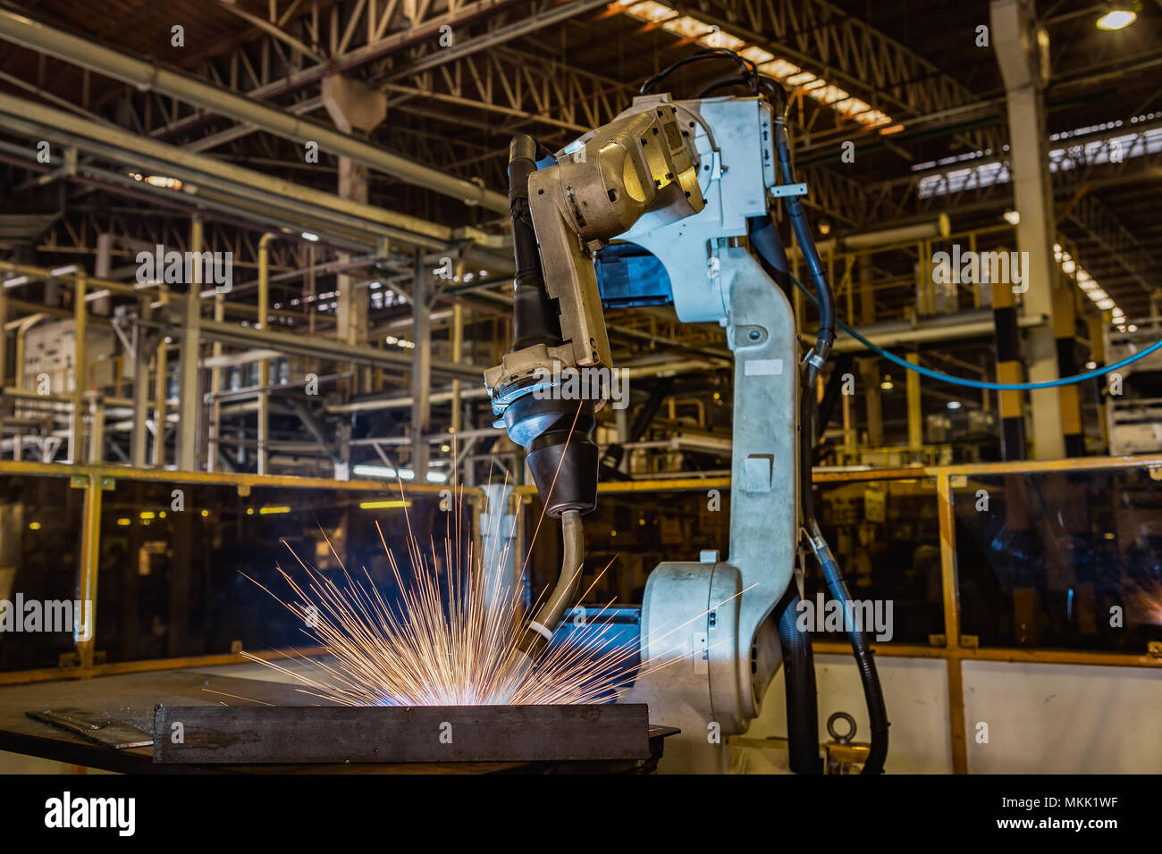 Industrial robot is test run new program in car factory Stock Photo