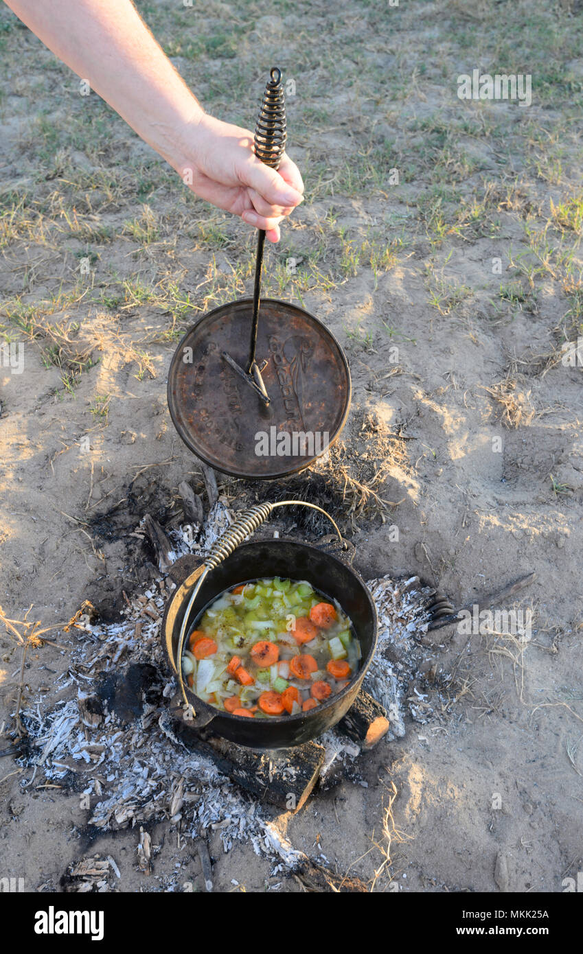 Vegetable stew being cooked in a camp oven while bush camping, Far North Queensland, FNQ, QLD, Australia Stock Photo