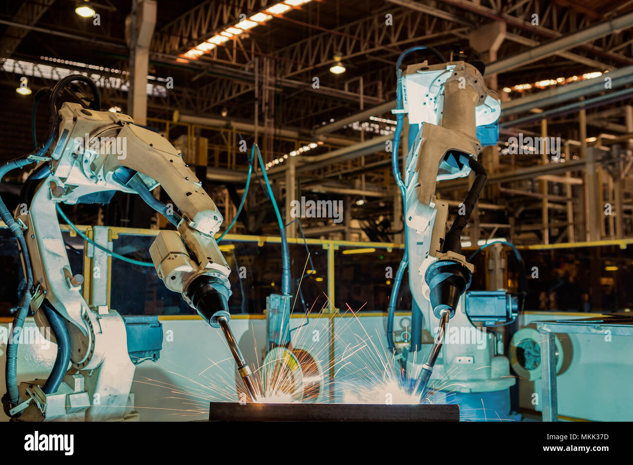 Industrial robot are test run new program in automotive assembly factory Stock Photo