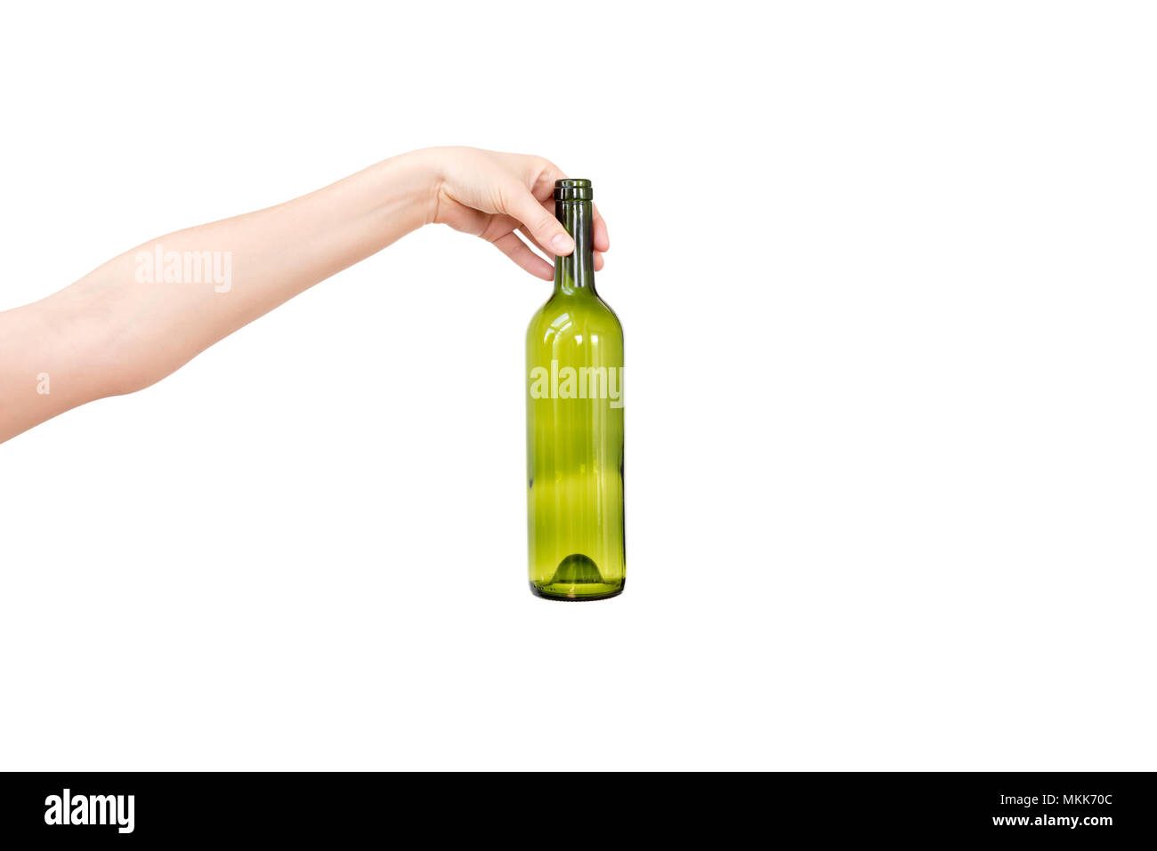 Female hand holding empty glass bottle isolated on white. Recyclable